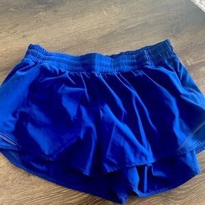 Worn a few times Blue lulululemon hottie shorts inseam 4 inch size 14 tall.